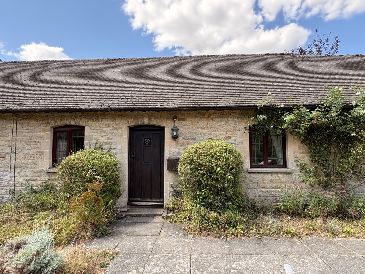 The Cotswold stone frontage of Lovegrove Cottage