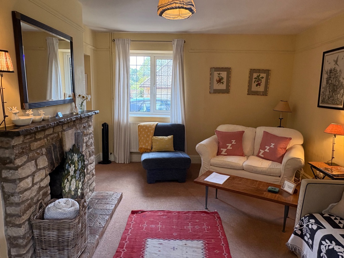 Living room seating area with sofas and village view